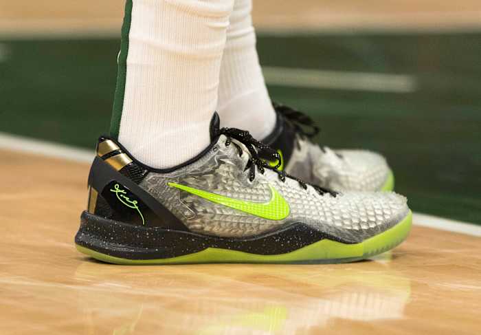 Kobe Bryant's grey and green Nike sneakers.